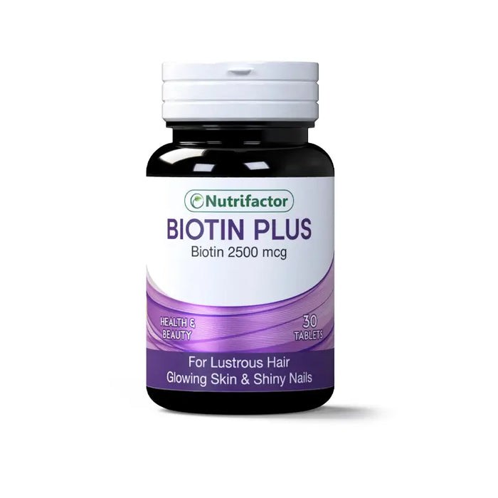 A jar of biotin tablets laying on a pharmacy counter