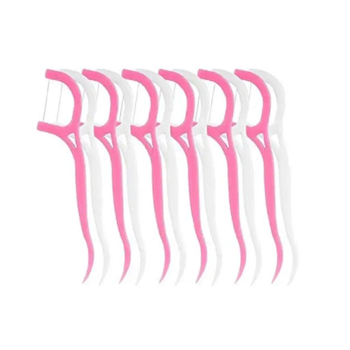 Set of dental floss picks with pink handles on a white background