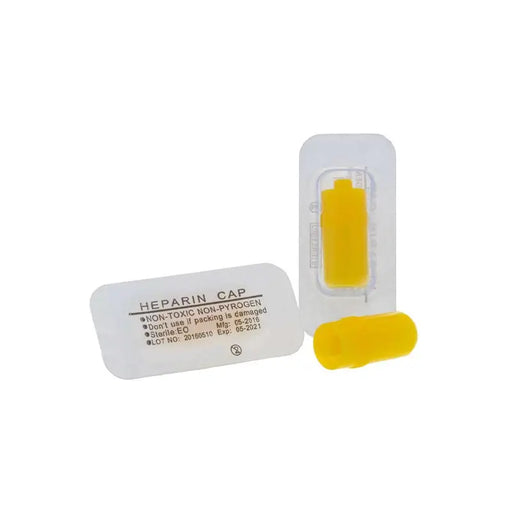 Heparin cap with yellow component on a white background