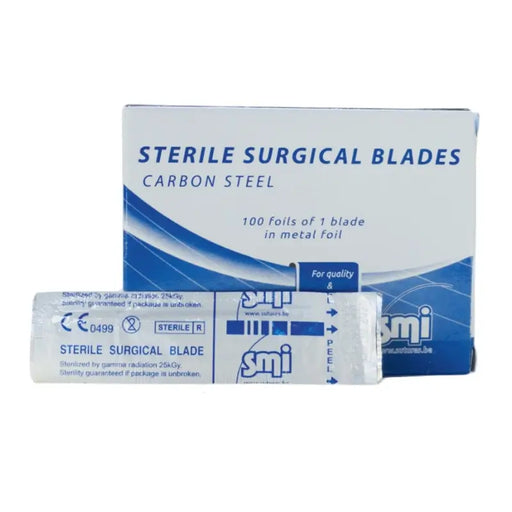 Box of sterile surgical blades with a single blade packet on a white background